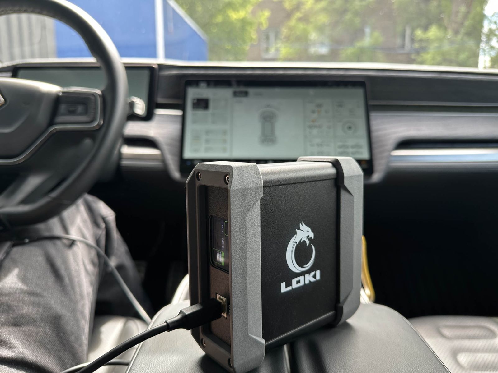 Diagnosing a Rivian vehicle using the LOKI PRO scanner in a workshop